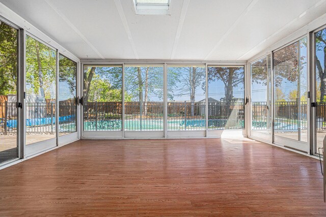 105 N Dr E, Marshall, MI 49068 - unfurnished sunroom with floor to ceiling windows and wood finished floors
