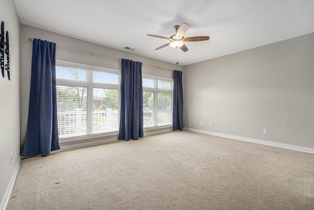603 Woodland, Dexter, MI 48130 - spare room with a ceiling fan, carpet, and baseboards