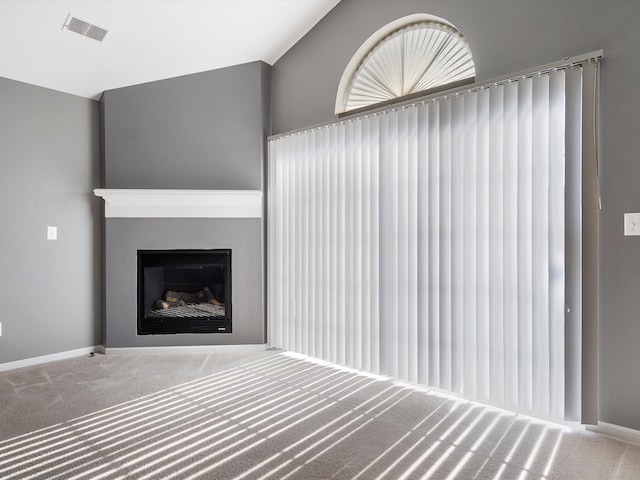 8204 Alexa Dr, Walled Lake, MI 48390 - unfurnished living room featuring carpet floors, a fireplace, and baseboards