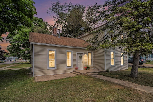501 E Paw Paw St, Paw Paw, MI 49079 - view of front of house featuring a yard and a chimney