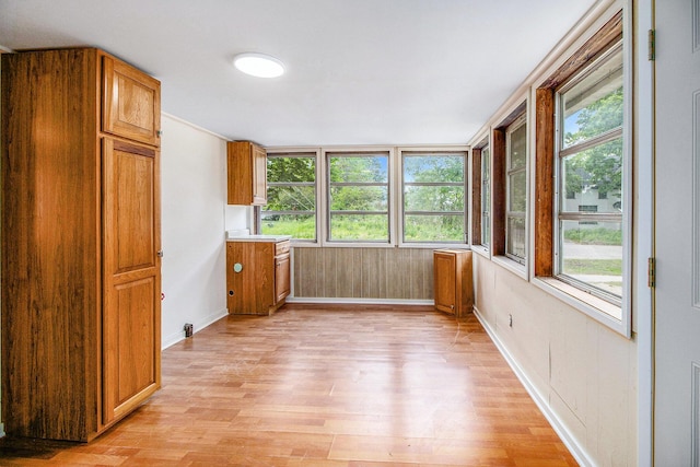 501 E Paw Paw St, Paw Paw, MI 49079 - unfurnished sunroom featuring wood finished floors and baseboards