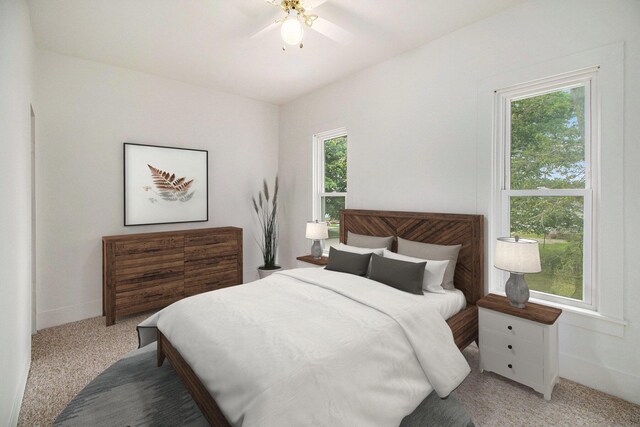 501 E Paw Paw St, Paw Paw, MI 49079 - carpeted bedroom with baseboards and ceiling fan