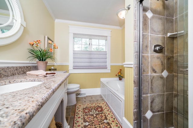 bathroom featuring wainscoting, ornamental molding, a shower stall, vanity, and toilet