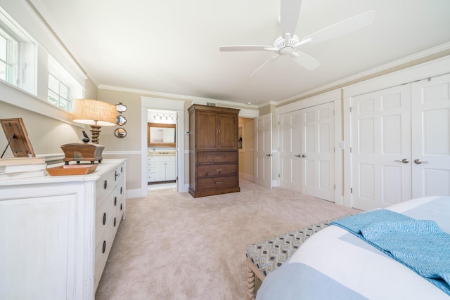 bedroom featuring two closets, ornamental molding, light colored carpet, baseboards, and ceiling fan