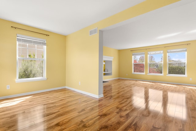 unfurnished room featuring light wood-style flooring and baseboards