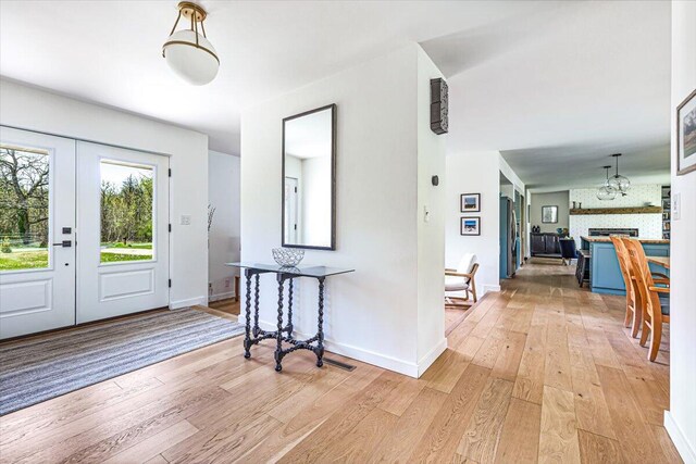 5407 Browntown Rd, Sawyer, MI 49125 - foyer with light wood-style floors, baseboards, and a fireplace