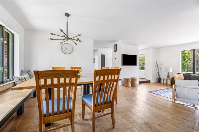 5407 Browntown Rd, Sawyer, MI 49125 - dining space featuring a chandelier and wood finished floors