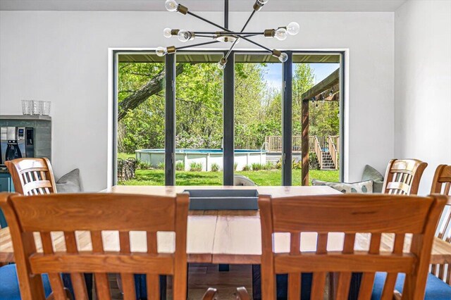 5407 Browntown Rd, Sawyer, MI 49125 - dining room featuring a chandelier and plenty of natural light