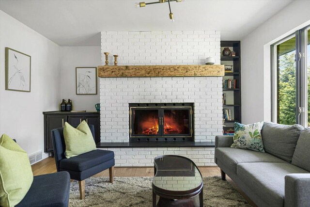 5407 Browntown Rd, Sawyer, MI 49125 - living room featuring a fireplace and wood finished floors
