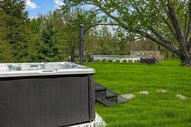 5407 Browntown Rd, Sawyer, MI 49125 - view of green lawn with a hot tub and central AC