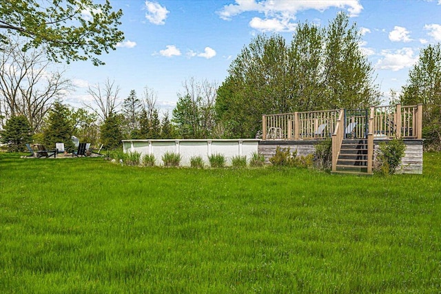 5407 Browntown Rd, Sawyer, MI 49125 - view of green lawn with a wooden deck and stairway