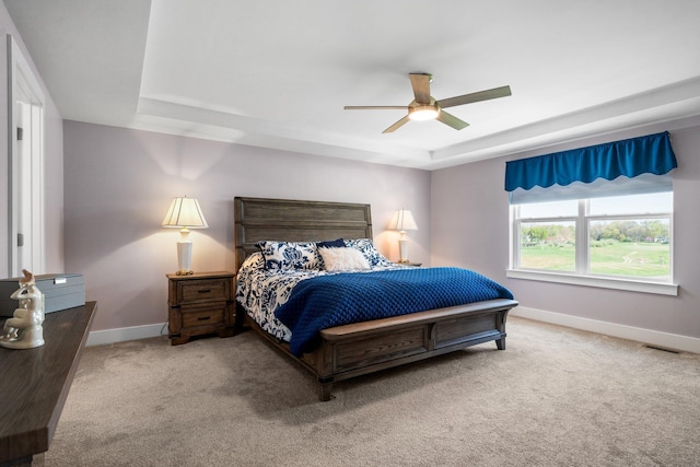 3120 Gecko Trl, Pinckney, MI 48169 - carpeted bedroom with baseboards, a raised ceiling, and a ceiling fan