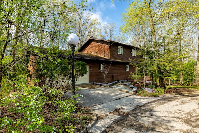 3949 Waldenwood Dr, Ann Arbor, MI 48105 - view of home's exterior featuring concrete driveway and an attached garage