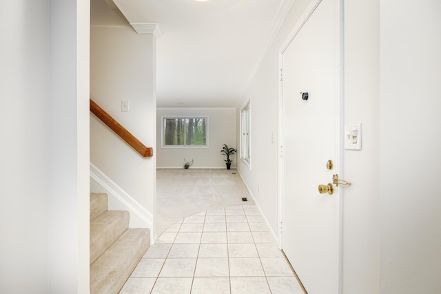 3949 Waldenwood Dr, Ann Arbor, MI 48105 - entrance foyer featuring ornamental molding, stairway, light colored carpet, and light tile patterned floors