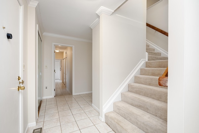 3949 Waldenwood Dr, Ann Arbor, MI 48105 - stairs featuring crown molding, tile patterned floors, and baseboards