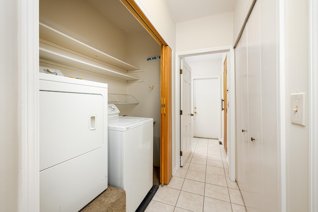 3949 Waldenwood Dr, Ann Arbor, MI 48105 - clothes washing area with washer and clothes dryer and light tile patterned flooring