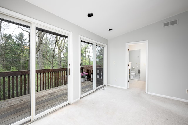 3949 Waldenwood Dr, Ann Arbor, MI 48105 - doorway featuring vaulted ceiling, baseboards, and carpet flooring