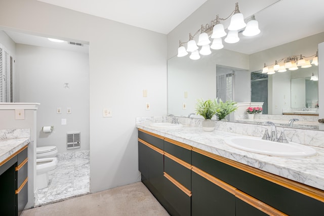 3949 Waldenwood Dr, Ann Arbor, MI 48105 - bathroom with a bidet, toilet, and double vanity