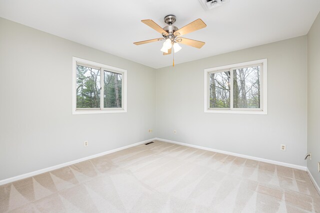 3949 Waldenwood Dr, Ann Arbor, MI 48105 - unfurnished room featuring plenty of natural light, baseboards, light carpet, and ceiling fan