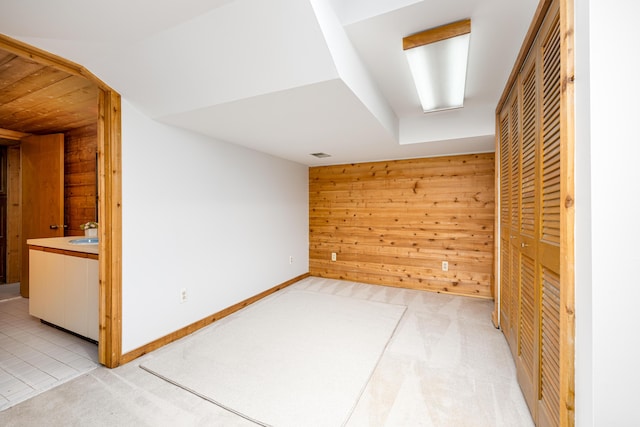 3949 Waldenwood Dr, Ann Arbor, MI 48105 - unfurnished room featuring wood walls and light colored carpet