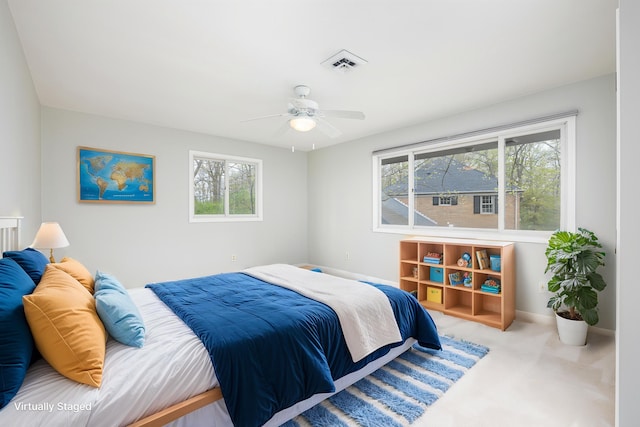 3949 Waldenwood Dr, Ann Arbor, MI 48105 - bedroom with multiple windows, carpet, baseboards, and a ceiling fan