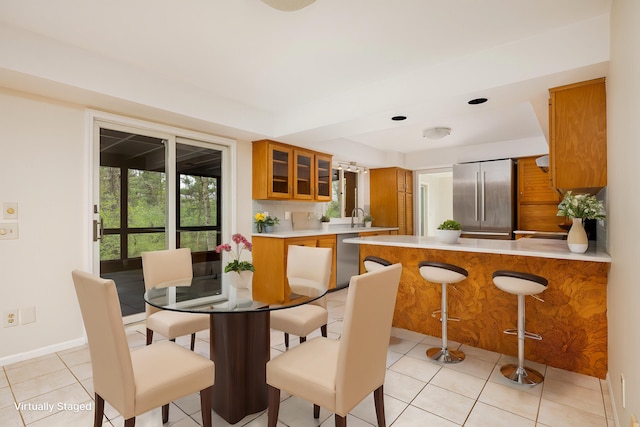 3949 Waldenwood Dr, Ann Arbor, MI 48105 - dining room with baseboards and light tile patterned floors