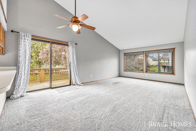 unfurnished living room with lofted ceiling, carpet, ceiling fan, and baseboards