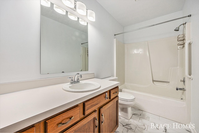 bathroom with marble look tile flooring, vanity, bathtub / shower combination, and toilet