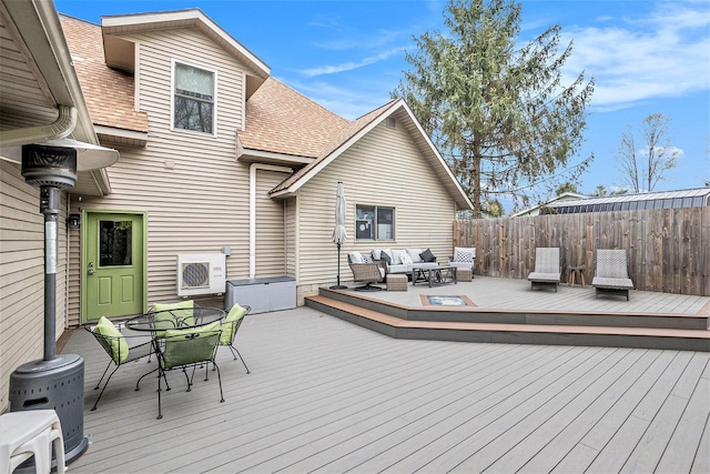 17389 Rapids Dr, Hersey, MI 49639 - wooden deck with outdoor lounge area, outdoor dining area, and fence