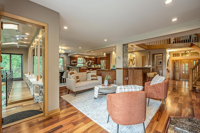 10985 E Pleasant Lake Rd, Manchester, MI 48158 - living room with a ceiling fan, wood-type flooring, stairs, and recessed lighting