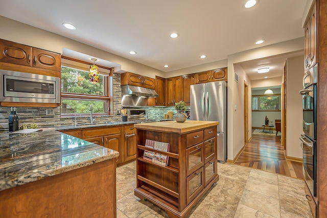 10985 E Pleasant Lake Rd, Manchester, MI 48158 - kitchen featuring appliances with stainless steel finishes, wood counters, tasteful backsplash, a sink, and under cabinet range hood
