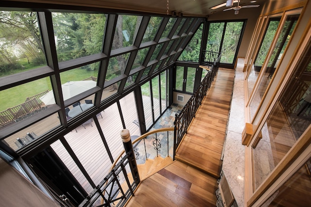10985 E Pleasant Lake Rd, Manchester, MI 48158 - staircase with hardwood / wood-style flooring and a ceiling fan