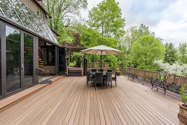 10985 E Pleasant Lake Rd, Manchester, MI 48158 - wooden deck with outdoor dining space and view of scattered trees