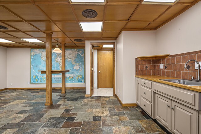 10985 E Pleasant Lake Rd, Manchester, MI 48158 - interior space featuring a sink, baseboards, and stone tile floors