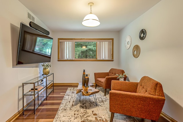 10985 E Pleasant Lake Rd, Manchester, MI 48158 - sitting room with dark wood finished floors and baseboards