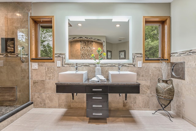 10985 E Pleasant Lake Rd, Manchester, MI 48158 - full bath with tile walls, tiled shower, tile patterned floors, a wainscoted wall, and double vanity
