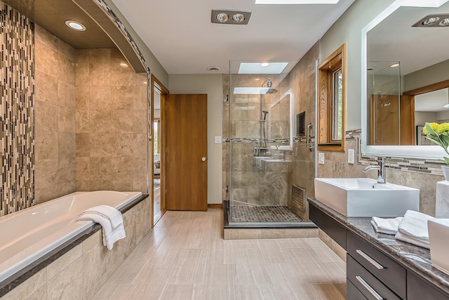 10985 E Pleasant Lake Rd, Manchester, MI 48158 - bathroom featuring vanity, a stall shower, a bath, and tile walls