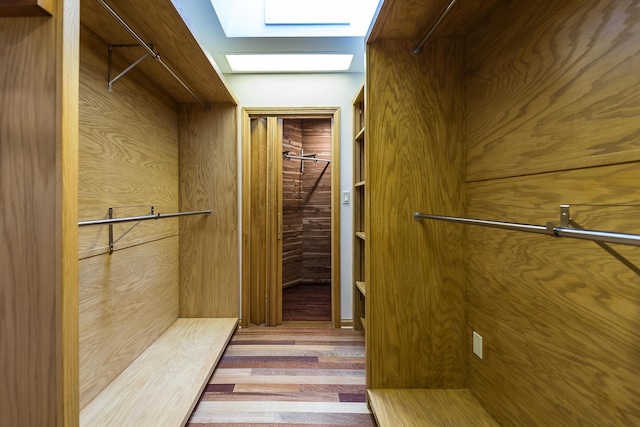 10985 E Pleasant Lake Rd, Manchester, MI 48158 - spacious closet featuring a skylight and wood finished floors