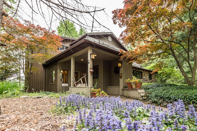 10985 E Pleasant Lake Rd, Manchester, MI 48158 - view of front of home featuring covered porch and board and batten siding