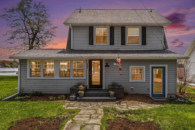 447 Paradise Ln, Horton, MI 49246 - traditional home with a front yard and a shingled roof