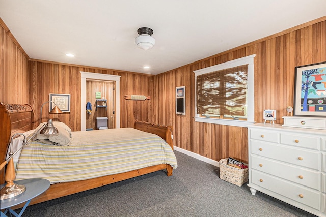 447 Paradise Ln, Horton, MI 49246 - carpeted bedroom featuring wood walls and access to exterior