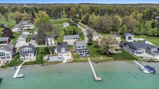 447 Paradise Ln, Horton, MI 49246 - aerial view of residential area featuring a nearby body of water and a heavily wooded area
