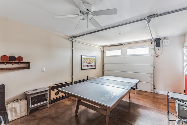 67592 95th Ave, Dowagiac, MI 49047 - recreation room featuring a garage, finished concrete flooring, and ceiling fan