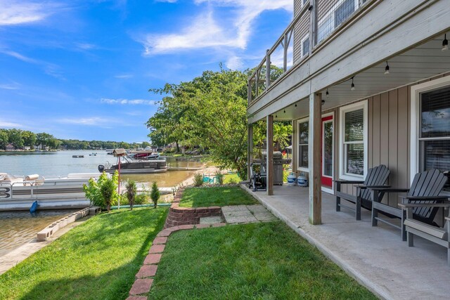 67592 95th Ave, Dowagiac, MI 49047 - view of green lawn featuring a water view and a patio area