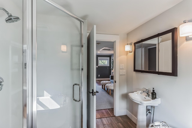 67592 95th Ave, Dowagiac, MI 49047 - full bath featuring a shower stall, wood finished floors, and baseboards