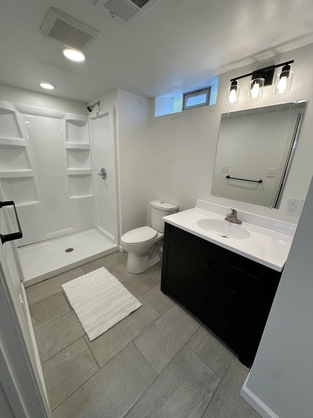 7150 Shenandoah Ave, Allen Park, MI 48101 - bathroom featuring vanity, a shower stall, toilet, recessed lighting, and tile patterned flooring