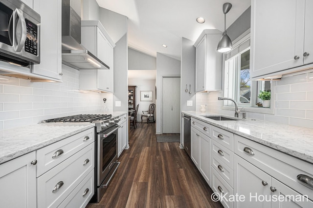 1334 Thornberry Ct W, Grand Rapids, MI 49546 - kitchen with a sink, vaulted ceiling, backsplash, wall chimney range hood, and appliances with stainless steel finishes