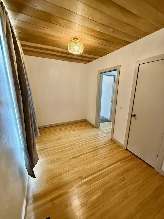 5795 S M37 Hwy, Hastings, MI 49058 - interior space with wood ceiling, light wood-style flooring, and baseboards