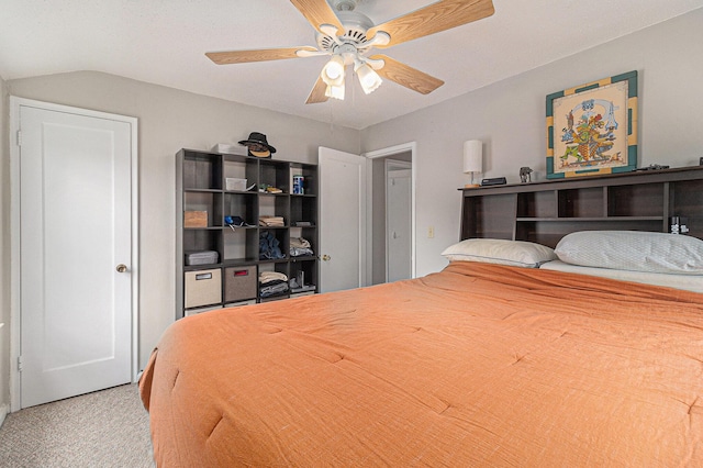 bedroom featuring carpet floors, lofted ceiling, and a ceiling fan