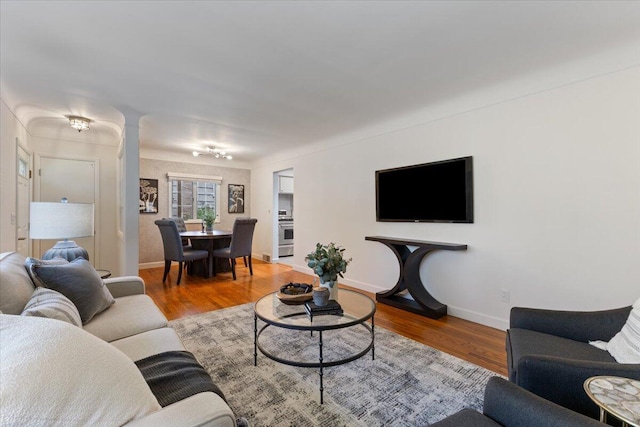 1610 Saunders Cres, Ann Arbor, MI 48103 - living area with baseboards, ornate columns, and wood finished floors